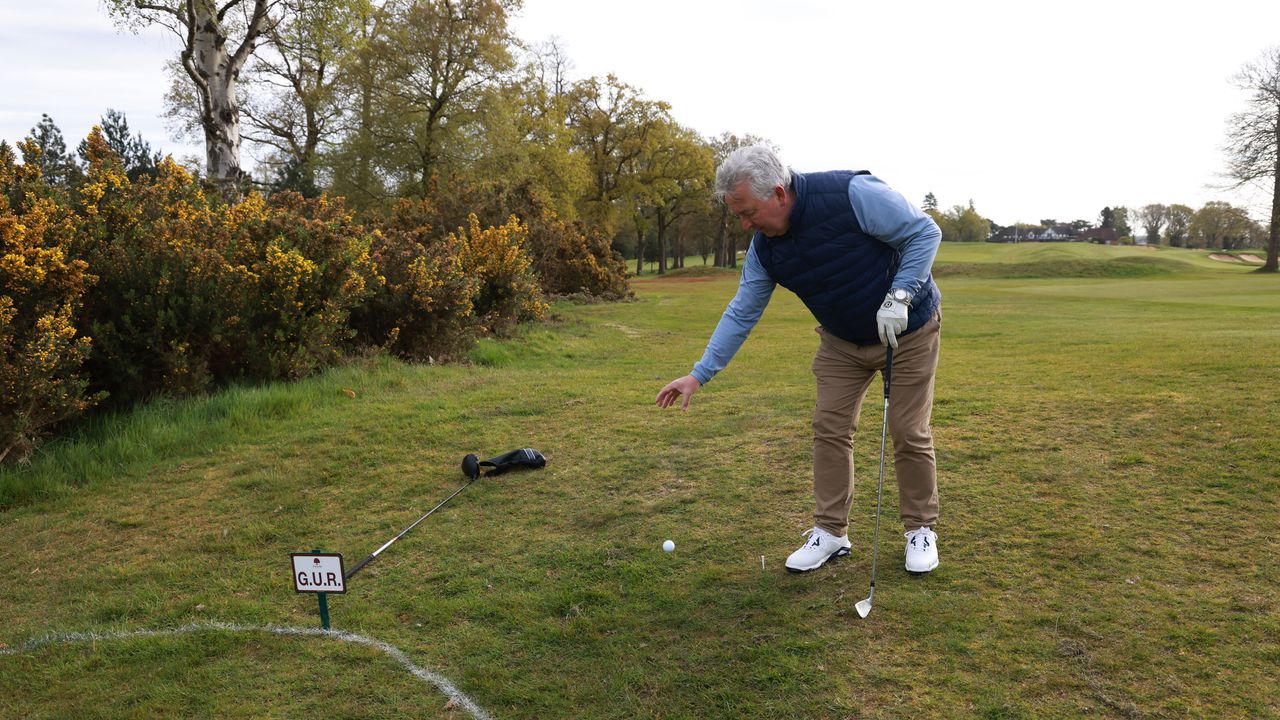 A player taking a drop from ground under repair